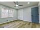 This bedroom features two windows, wood floors, closet and a ceiling fan with light, offering a comfortable space at 3421 Fawn Trl, Marietta, GA 30066