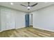 Spacious bedroom featuring stylish flooring, a modern ceiling fan, and ample closet space at 3421 Fawn Trl, Marietta, GA 30066