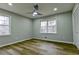 Bedroom with hardwood floors, neutral walls, ceiling fan, and bright windows at 3421 Fawn Trl, Marietta, GA 30066