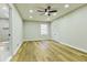 Bedroom featuring stylish flooring, a modern ceiling fan, and an ensuite bathroom at 3421 Fawn Trl, Marietta, GA 30066