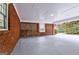 Large brick carport with lattice brick accents, concrete floor and great light at 3421 Fawn Trl, Marietta, GA 30066