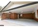 Attached carport area with brick columns, ceiling fan, and utility door at 3421 Fawn Trl, Marietta, GA 30066