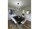 Elegant dining room with modern lighting, stylish decor, and ample seating for entertaining at 3421 Fawn Trl, Marietta, GA 30066