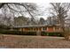 Charming single-story brick home featuring new wood shutters and a landscaped front yard at 3421 Fawn Trl, Marietta, GA 30066