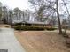 Brick ranch home with mature landscaping, long driveway, and wooden shutters at 3421 Fawn Trl, Marietta, GA 30066