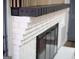Close up of the modern painted brick fireplace with dark wood accents at 3421 Fawn Trl, Marietta, GA 30066