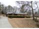 Charming brick home featuring green hedges and a long driveway at 3421 Fawn Trl, Marietta, GA 30066