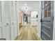 Hallway with wood floors and view to living room and kitchen with stainless steel appliances at 3421 Fawn Trl, Marietta, GA 30066