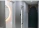 Hallway with modern doors and accent wall, illuminated mirror, hardwood flooring at 3421 Fawn Trl, Marietta, GA 30066