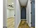 Hallway featuring modern doors and accent wall with hardwood flooring and modern ceiling fan at 3421 Fawn Trl, Marietta, GA 30066