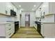 Bright kitchen with white cabinets, black appliances and modern fixtures at 3421 Fawn Trl, Marietta, GA 30066