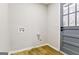 This laundry room is bright, with wood floors, access to the exterior and all hookups at 3421 Fawn Trl, Marietta, GA 30066
