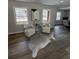 Bright living room features wood floors, neutral colors, and plenty of natural light from updated windows at 3421 Fawn Trl, Marietta, GA 30066