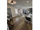 Bright and open living area with wood floors, abundant natural light, and a view into the dining area at 3421 Fawn Trl, Marietta, GA 30066
