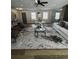 Open-concept living room with wood floors, neutral tones, modern lighting, and updated windows at 3421 Fawn Trl, Marietta, GA 30066