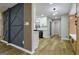 Open-concept living space featuring a modern accent wall and hardwood floors at 3421 Fawn Trl, Marietta, GA 30066