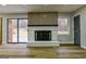 The living room features a painted brick fireplace, wood floors and glass patio door at 3421 Fawn Trl, Marietta, GA 30066
