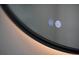 Close up of a round mirror with integrated lighting and touch controls at 3421 Fawn Trl, Marietta, GA 30066