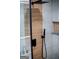 Close up of shower with wood-look tile detail at 3421 Fawn Trl, Marietta, GA 30066