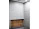 Close up of shower niche with wooden backing and textured gray tiles at 3421 Fawn Trl, Marietta, GA 30066