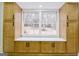 Cozy window seat with built-in cabinets offering storage and a view of the backyard, perfect for relaxation at 3421 Fawn Trl, Marietta, GA 30066