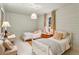 Light and airy bedroom featuring twin beds with soft blue walls and natural light, creating a serene atmosphere at 240 Nacoochee Nw Dr, Atlanta, GA 30305