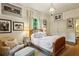 Cozy bedroom with neutral tones and white shiplap walls, featuring a wood-framed bed and stylish decor at 240 Nacoochee Nw Dr, Atlanta, GA 30305