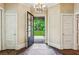 Grand foyer showcasing an open doorway to an expansive garden view at 240 Nacoochee Nw Dr, Atlanta, GA 30305
