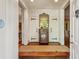 Inviting foyer with hardwood floors, classic console table, and views to other rooms at 240 Nacoochee Nw Dr, Atlanta, GA 30305