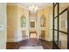 Elegant foyer featuring brick floors, detailed trim, and garden view at 240 Nacoochee Nw Dr, Atlanta, GA 30305