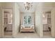 Bright hallway featuring a window bench and matching doors leading to bathrooms at 240 Nacoochee Nw Dr, Atlanta, GA 30305