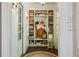 Hallway with white trim, built-in shelves, and a view of the outdoors at 240 Nacoochee Nw Dr, Atlanta, GA 30305