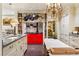 Bright kitchen features custom cabinetry, chef's range and island with stone countertop at 240 Nacoochee Nw Dr, Atlanta, GA 30305