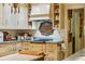 Stylish kitchen featuring a gas cooktop, custom cabinetry, and marble countertops at 240 Nacoochee Nw Dr, Atlanta, GA 30305