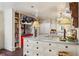 Spacious kitchen with an island, farmhouse sink, and open shelving for storage at 240 Nacoochee Nw Dr, Atlanta, GA 30305