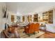 Cozy living room featuring hardwood floors, built-in shelving, and comfortable seating at 240 Nacoochee Nw Dr, Atlanta, GA 30305