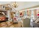 Elegant living room featuring comfortable seating, a fireplace, and art-covered walls at 240 Nacoochee Nw Dr, Atlanta, GA 30305