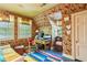 Cozy home office featuring floral wallpaper, bright rug, and natural light at 240 Nacoochee Nw Dr, Atlanta, GA 30305