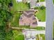 Aerial view of home with mature landscaping, spacious backyard, and well-maintained roof at 310 Medridge Dr, Alpharetta, GA 30022