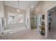 Relaxing bathroom with soaking tub, tiled surround, and separate glass shower at 310 Medridge Dr, Alpharetta, GA 30022