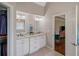 Bathroom features double sinks with white cabinets and granite counters at 310 Medridge Dr, Alpharetta, GA 30022