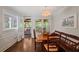 Bright dining area with hardwood floors and access to a screened-in porch at 310 Medridge Dr, Alpharetta, GA 30022