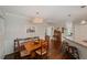Traditional dining room with bench seating, wooden table, hardwood floors, and view into the kitchen, perfect for Gathering meals at 310 Medridge Dr, Alpharetta, GA 30022