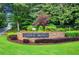 Medlock Bridge community sign amidst lush landscaping with vibrant flowers and manicured lawn at 310 Medridge Dr, Alpharetta, GA 30022