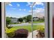 View from the doorway showcasing the neighborhood's curb appeal with lawns and mature trees at 310 Medridge Dr, Alpharetta, GA 30022