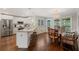 Spacious kitchen with stainless steel appliances, breakfast bar, and an adjacent dining area at 310 Medridge Dr, Alpharetta, GA 30022