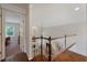 Bright landing featuring hardwood floors, white railings, and an open view to the living room below at 310 Medridge Dr, Alpharetta, GA 30022