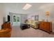 Bright basement living room featuring neutral paint, door to backyard, and wood dresser at 310 Medridge Dr, Alpharetta, GA 30022