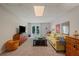 Basement living room showcasing a comfortable sofa, a TV, and backyard access at 310 Medridge Dr, Alpharetta, GA 30022