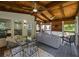 The screened-in porch features a dining area and cozy seating, perfect for enjoying the outdoors in comfort at 310 Medridge Dr, Alpharetta, GA 30022